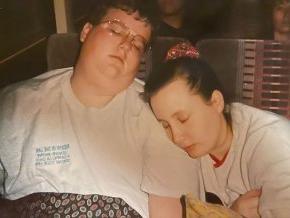 Natisha and Tyler Prince snooze on the A Cappella Choir tour bus